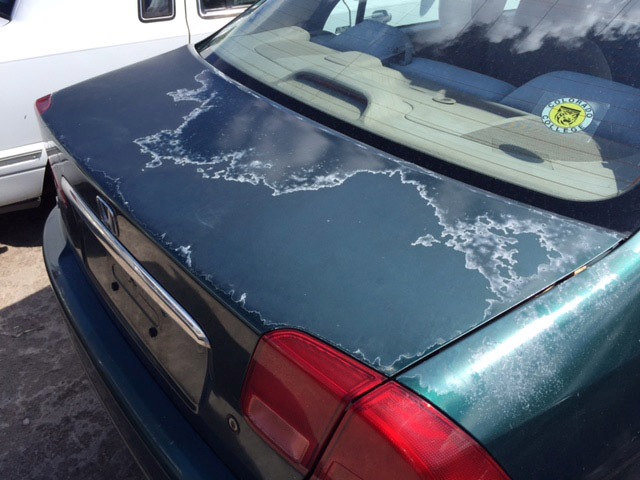 car paint oxidation. aded and oxidized car paint
